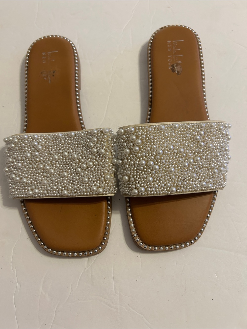 Nicole Miller Pearl-Embellished Cream Slide Sandals